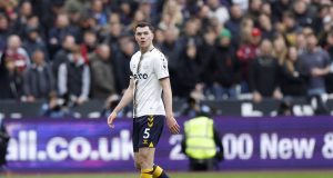 Everton's Michael Keane walks off the pitch after being sent off