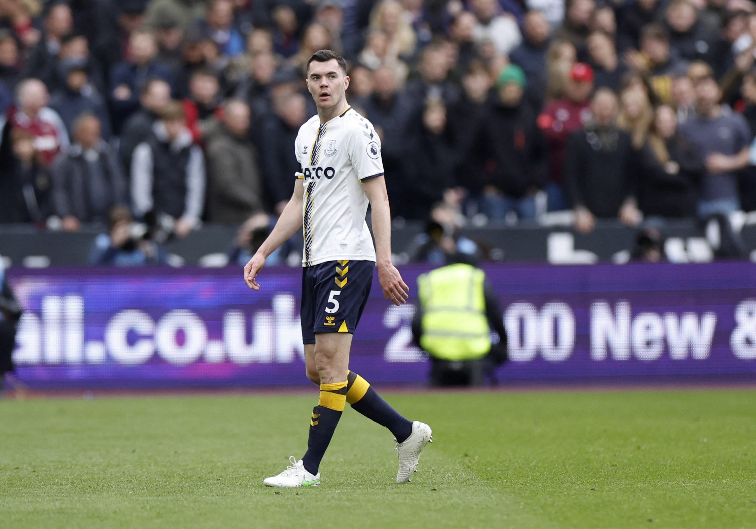 Everton's Michael Keane walks off the pitch after being sent off