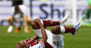 West Ham United's Issa Diop reacts after sustaining an injury Action Images via Reuters/Andrew Boyers