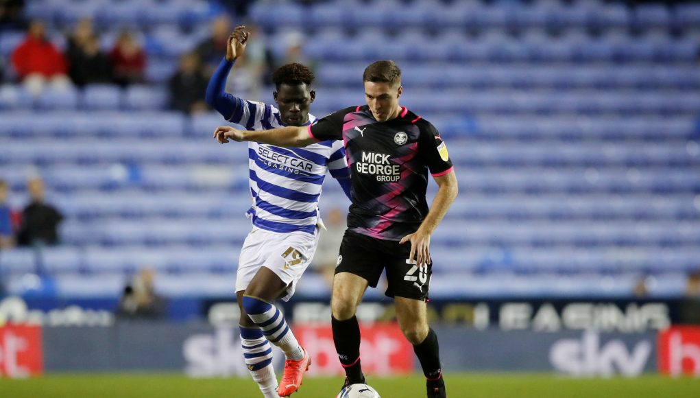 Reading's Tom Dele Bashiru in action with Peterborough United's Conor Coventry