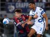 Inter Milan's Denzel Dumfries in action with Bologna's Aaron Hickey REUTERS/Jennifer Lorenzini