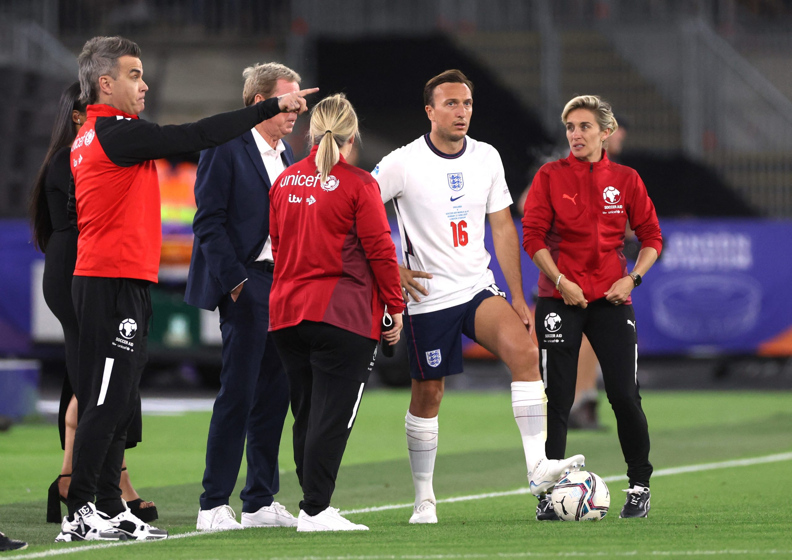 Robbie Williams with England's Harry Redknapp, Emma Hayes, Mark Noble and Vicky Mcclure Action Images via Reuters/Matthew Childs