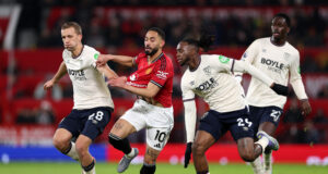 Matheus Cunha of Manchester United and Tomas Soucek and Aaron Wan-Bissaka of West Ham United . (Justin Setterfield/Getty Images)
