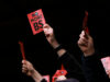 West Ham fans protest with red cards