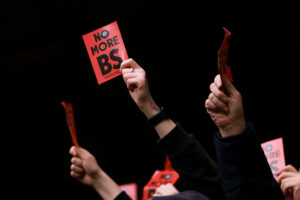 West Ham fans protest with red cards